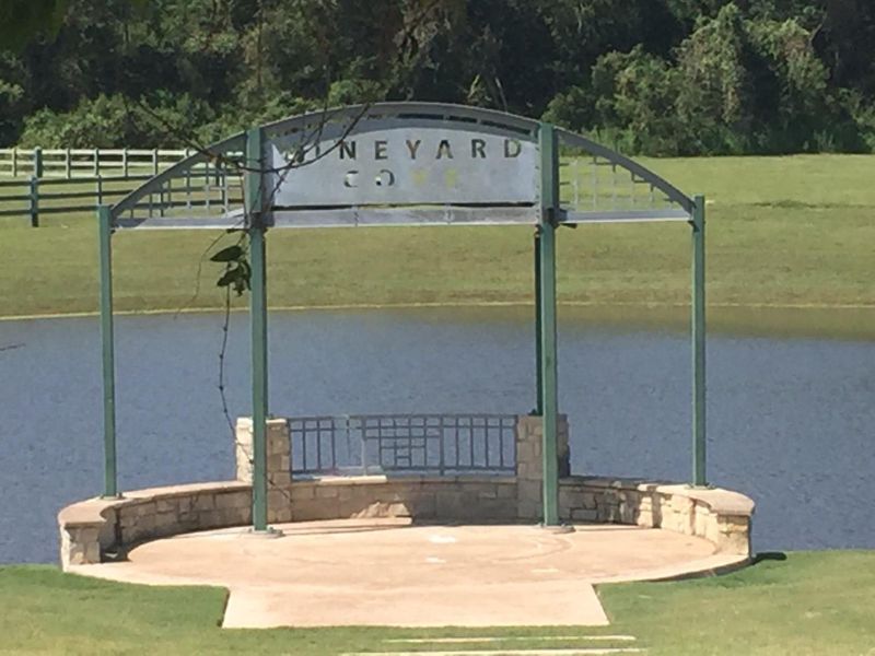 The amphitheater is behind the lodge but overlooking the lake.