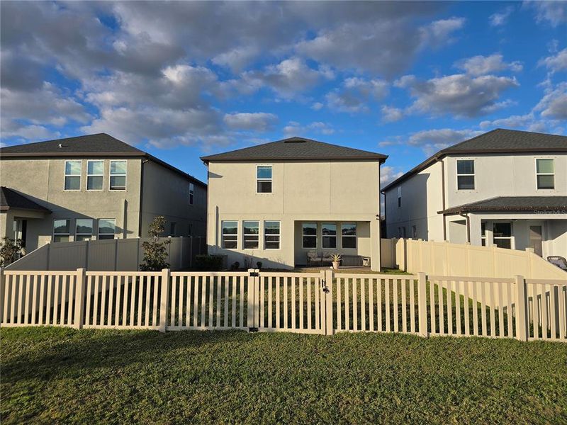Exterior details and patio area of a home in Bryant Square: The Manors, New Port Richey (Image 30).