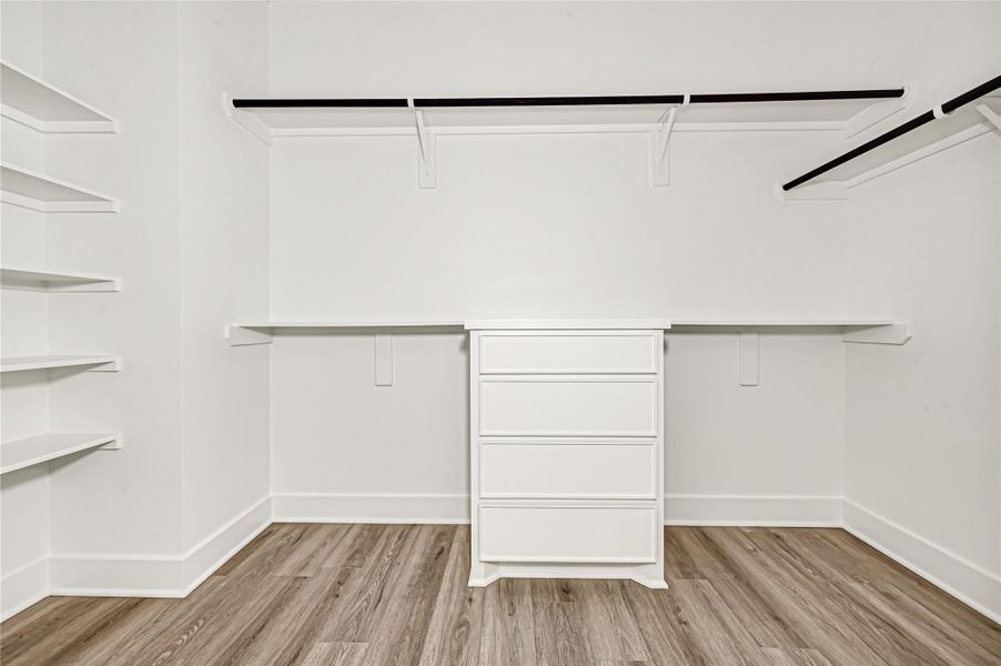 Spacious closet with built-in shelving and excellent storage space. Spacious closet with built-in shelving and excellent storage space.
