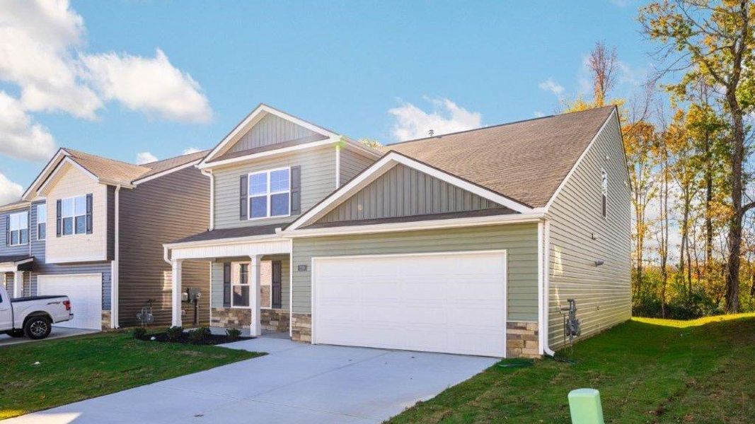 Front exterior of a new home in Hawk's Ridge, Rossville, GA, highlighting curb appeal (Image 19).