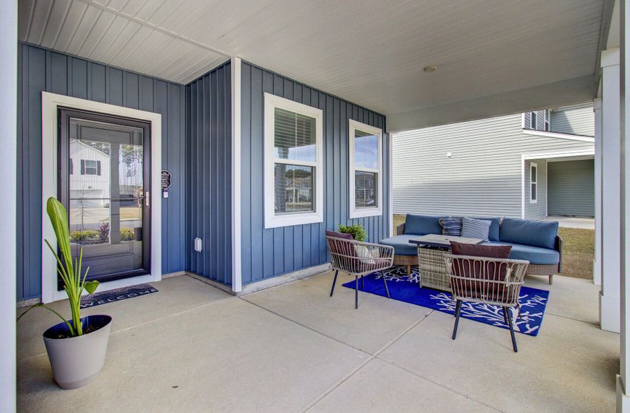 Exterior details and patio area of a home in Sanctuary Cove at Cane Bay, Summerville (Image 4).