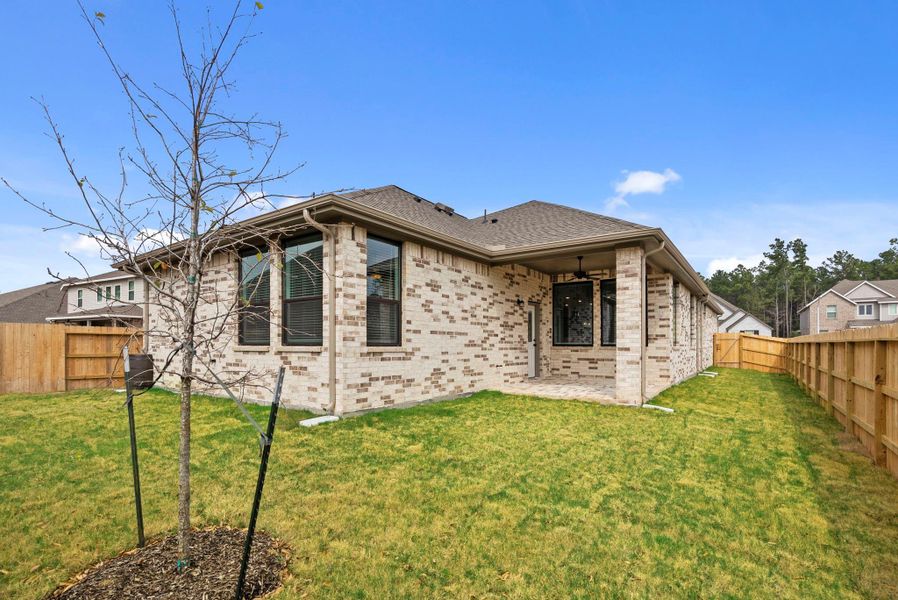 Exterior details and patio area of a home in Artavia, Conroe (Image 3). Exterior details and patio area of a home in Artavia, Conroe (Image 3).