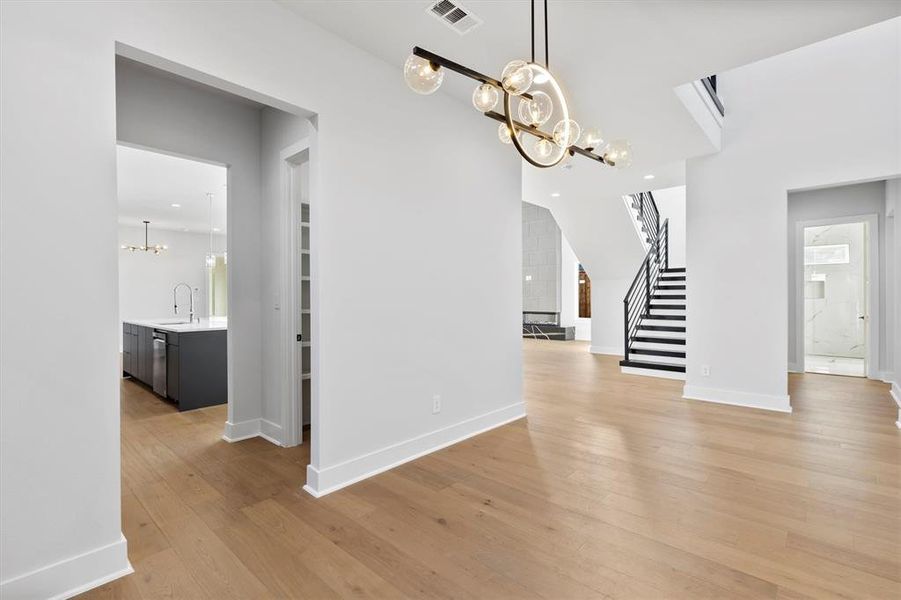 Unfurnished dining area featuring light hardwood / wood-style floors and sink