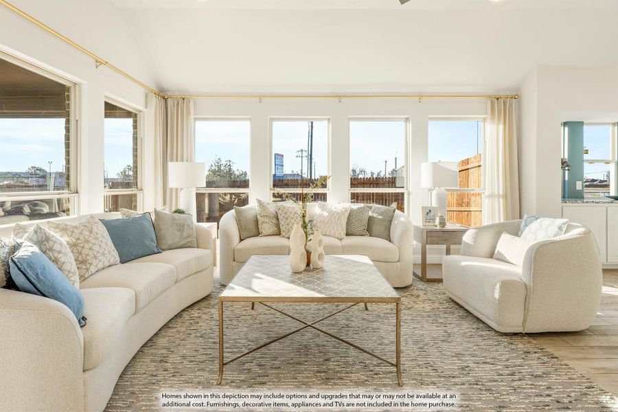 Bright living room with three white sofas, gold coffee table, and large windows with natural light Bright living room with three white sofas, gold coffee table, and large windows with natural light