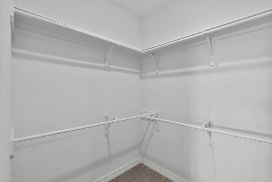 Spacious walk in primary closet!