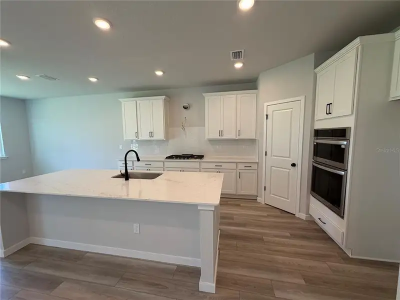Furnished interior view inside a new home in Reserve East, Flagler Beach (Image 7).