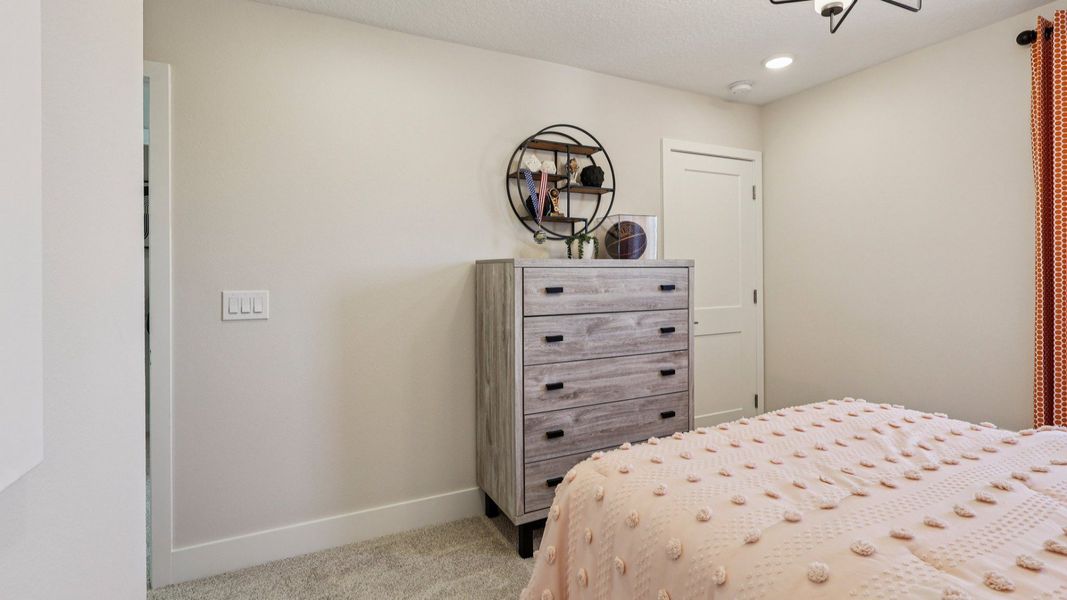 The Mangrove Second Floor Bedroom at Lakeside at Satilla by DRB Homes in Saint Cloud, FL