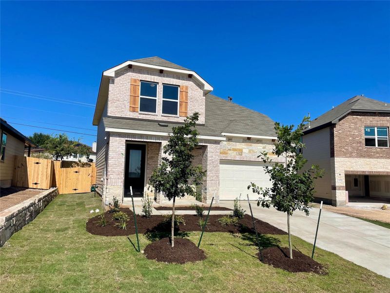 Front exterior of a new home in Covered Bridge, Hutto, TX, highlighting curb appeal (Image 24). Front exterior of a new home in Covered Bridge, Hutto, TX, highlighting curb appeal (Image 24).