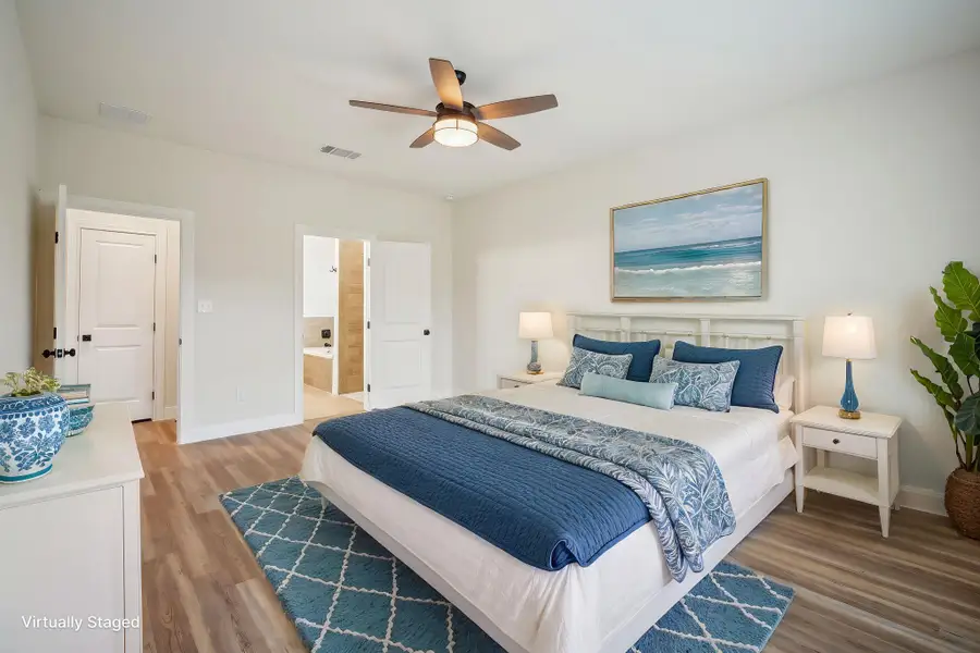 Virtually Staged Primary Bedroom with a ceiling fan, baseboards, visible vents, and light wood finished floors