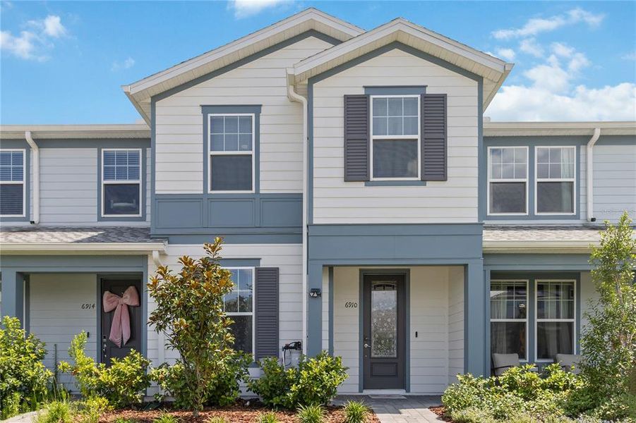 Front exterior of a new home in , Orlando, FL, highlighting curb appeal (Image 2). Front exterior of a new home in , Orlando, FL, highlighting curb appeal (Image 2).