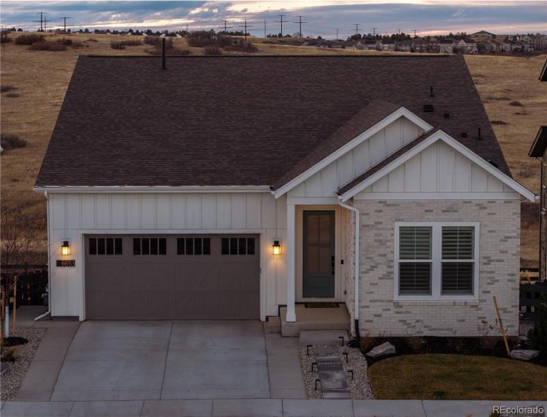 Front exterior of a new home in Gallery at The Canyons, Castle Pines, CO, highlighting curb appeal (Image 2). Front exterior of a new home in Gallery at The Canyons, Castle Pines, CO, highlighting curb appeal (Image 2).