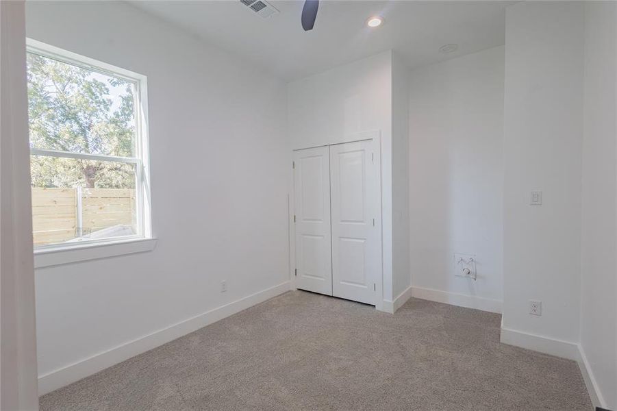 Attached In-Law Suite with light colored carpet, recessed lighting, a closet, and a ceiling fan Attached In-Law Suite with light colored carpet, recessed lighting, a closet, and a ceiling fan