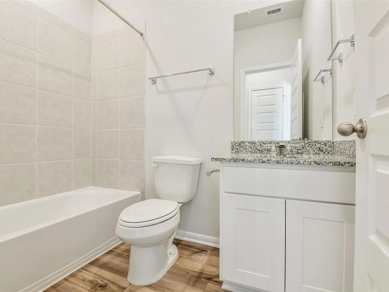 Furnished interior view inside a new home in Caney Creek Place, Conroe (Image 12).