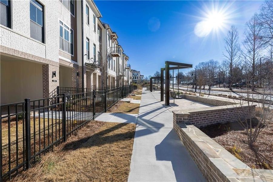 Just outside of homesite 29 is a sidewalk that leads to the front of the community and towards lots of dining options. You will also find picnic tables and benches for you to enjoy.