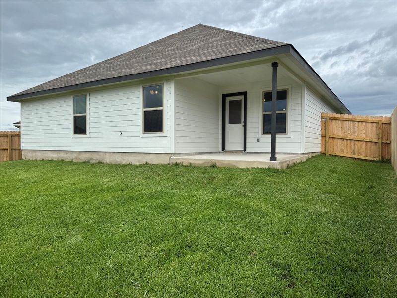 Front exterior of a new home in Liberty Village, Brenham, TX, highlighting curb appeal (Image 5).