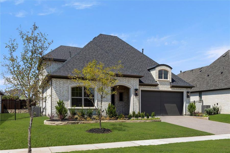 Front exterior of a new home in Windsong Ranch – 61′, Prosper, TX, highlighting curb appeal (Image 22). Front exterior of a new home in Windsong Ranch – 61′, Prosper, TX, highlighting curb appeal (Image 22).