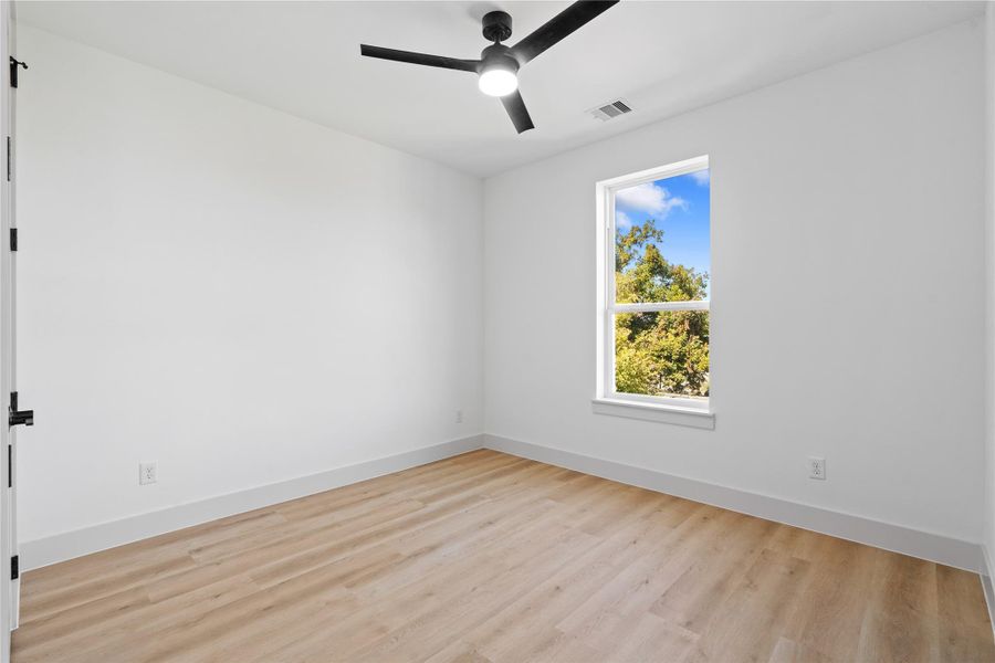 A serene secondary guest suite, complete with a walk-in closet, ceiling fan & an ensuite designed for privacy & comfort. A serene secondary guest suite, complete with a walk-in closet, ceiling fan & an ensuite designed for privacy & comfort.