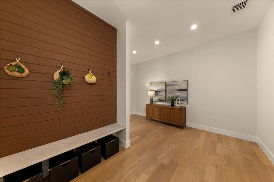 Hallway with recessed lighting and light wood-style flooring
