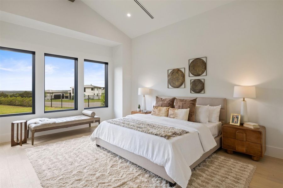 Bedroom featuring high vaulted ceiling, baseboards, light wood-style floors, and recessed lighting Bedroom featuring high vaulted ceiling, baseboards, light wood-style floors, and recessed lighting