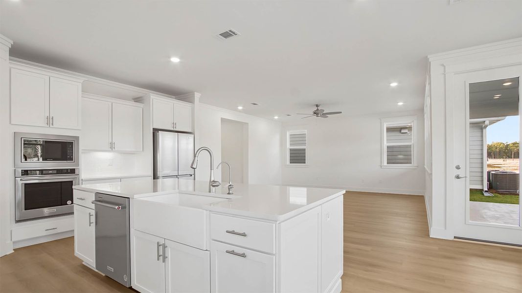 Representative furnished interior of a home built from the Trenton by D.R. Horton in Parkside, Santa Rosa Beach (Image 9).