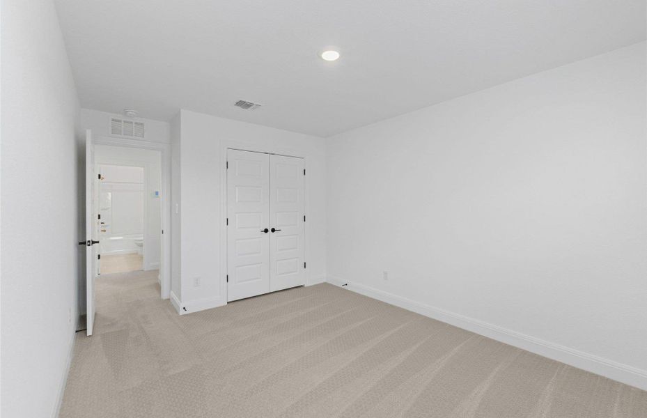 Unfurnished bedroom featuring light carpet, a closet, and recessed lighting Unfurnished bedroom featuring light carpet, a closet, and recessed lighting