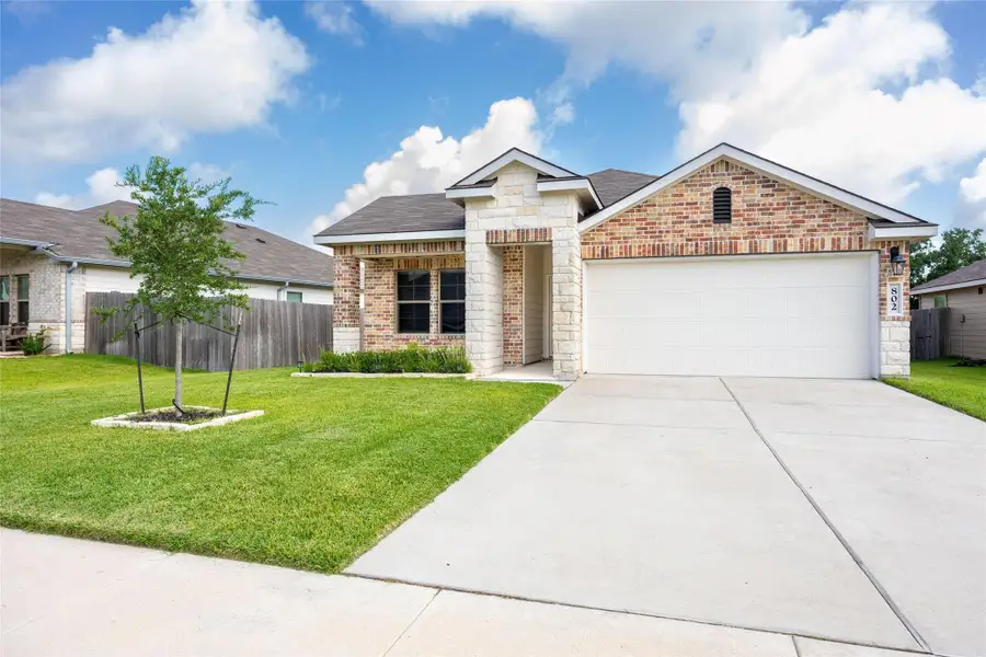 Front exterior of a new home in , Brenham, TX, highlighting curb appeal (Image 1). Front exterior of a new home in , Brenham, TX, highlighting curb appeal (Image 1).