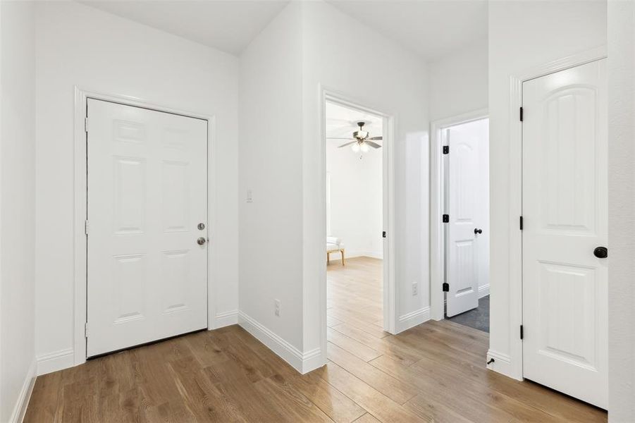 Entryway featuring light hardwood / wood-style floors and ceiling fan