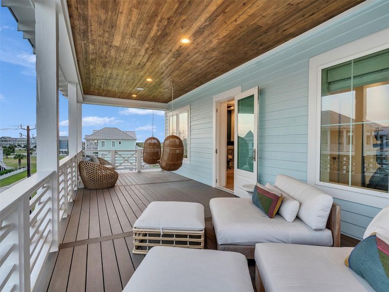 Step onto this spacious porch and feel instantly relaxed. Lounge on the plush, cushioned seating or sway gently in the hanging chairs while taking in protected Gulf views and gentle coastal breezes. Perfect for morning coffee, sunset cocktails, or unwinding after a beach day, this outdoor retreat blends comfort, style, and effortless beachside living. Weather-rated ceiling speakers and room to lounge or dine, every moment here captures the joy, luxury, and relaxed rhythm of beachside living. Step onto this spacious porch and feel instantly relaxed. Lounge on the plush, cushioned seating or sway gently in the hanging chairs while taking in protected Gulf views and gentle coastal breezes. Perfect for morning coffee, sunset cocktails, or unwinding after a beach day, this outdoor retreat blends comfort, style, and effortless beachside living. Weather-rated ceiling speakers and room to lounge or dine, every moment here captures the joy, luxury, and relaxed rhythm of beachside living.