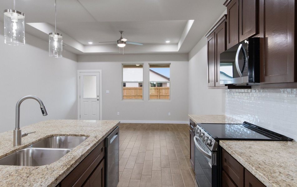 Representative furnished interior of a home built from the Clovis by Hakes Brothers in Monte Cielo, Weslaco (Image 3).