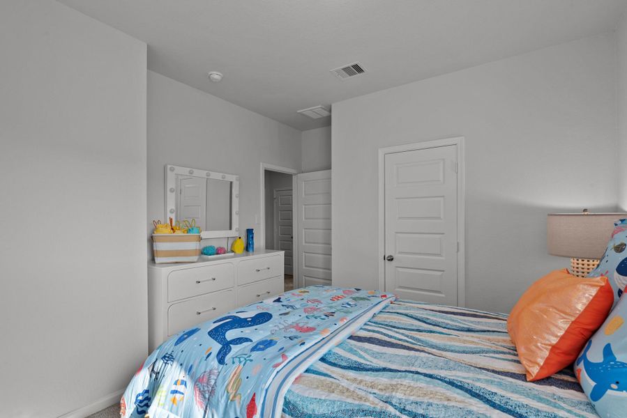 The Waring III- Bedroom 2. Staged model home shown for illustration only; actual features, colors, and upgrades may vary. The Waring III- Bedroom 2. Staged model home shown for illustration only; actual features, colors, and upgrades may vary.
