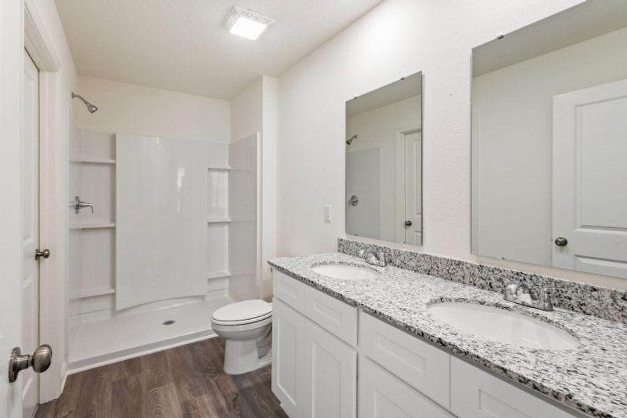 A bathroom with a marble countertop. A bathroom with a marble countertop.