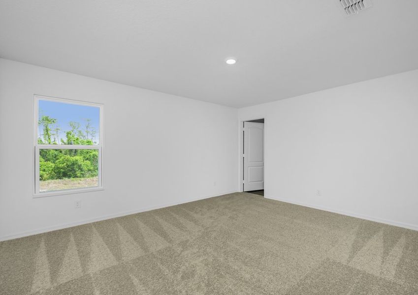 The master bedroom is spacious and has access to its own bathroom