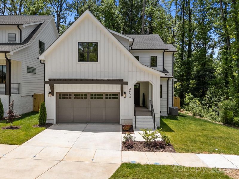 Front exterior of a new home in , Charlotte, NC, highlighting curb appeal (Image 1).