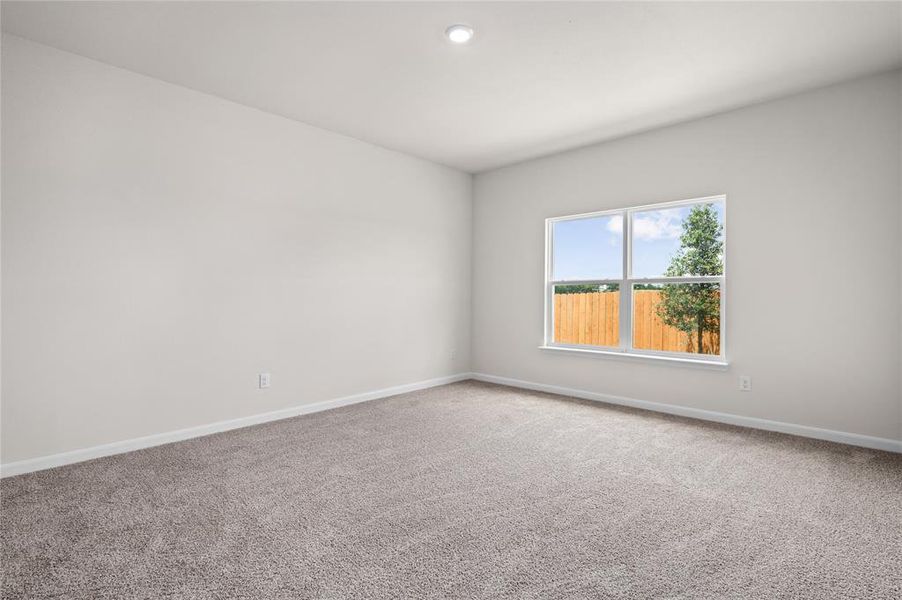 Carpeted spare room featuring baseboards and recessed lighting