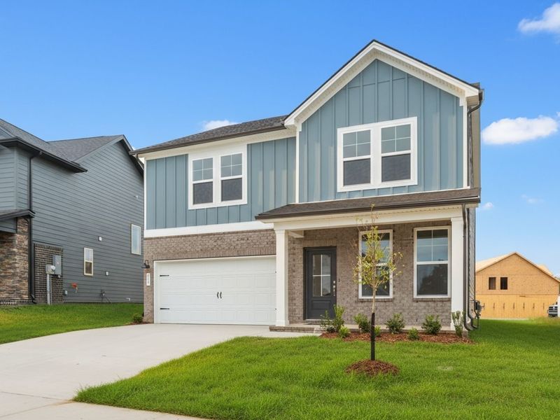Front exterior of a new home in Woods Crossing, Gallatin, TN, highlighting curb appeal (Image 2).