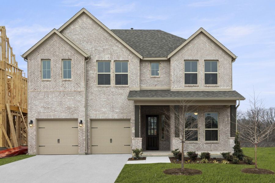 Front exterior of a new home in Providence Cove, McKinney, TX, highlighting curb appeal (Image 1). Front exterior of a new home in Providence Cove, McKinney, TX, highlighting curb appeal (Image 1).