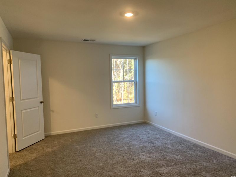 Empty room featuring carpet flooring and recessed lighting