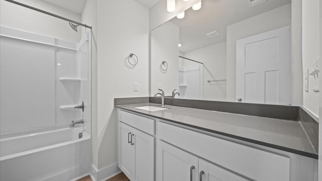 Well-appointed full bath with high standards of craftsmanship and everyday function Well-appointed full bath with high standards of craftsmanship and everyday function