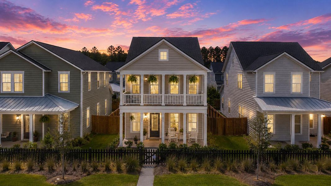 Front exterior of a new home in Sweetgrass at Summers Corner, Summerville, SC, highlighting curb appeal (Image 2). Front exterior of a new home in Sweetgrass at Summers Corner, Summerville, SC, highlighting curb appeal (Image 2).