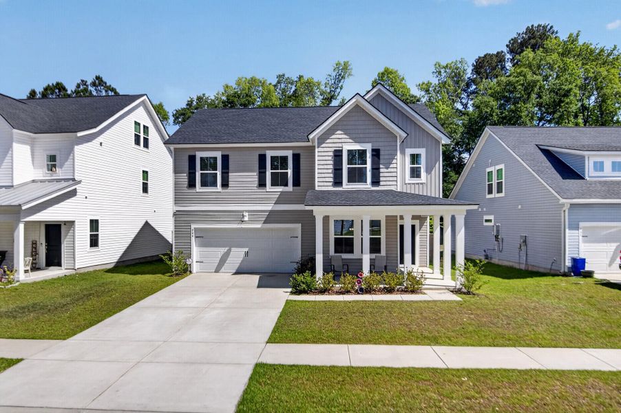 Front exterior of a new home in Limehouse Village: Arbor Series, Summerville, SC, highlighting curb appeal (Image 2). Front exterior of a new home in Limehouse Village: Arbor Series, Summerville, SC, highlighting curb appeal (Image 2).