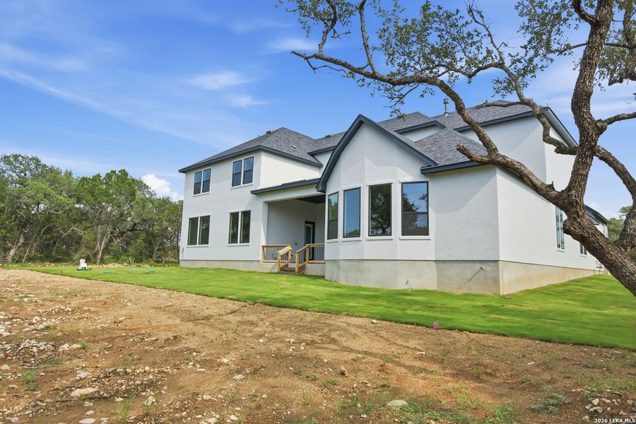 Exterior details and patio area of a home in Enchanted Bluff, San Antonio (Image 30).