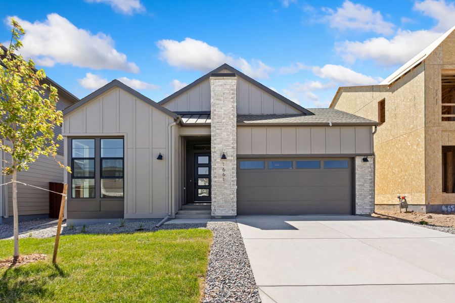 Front exterior of a new home in RainDance, Windsor, CO, highlighting curb appeal (Image 1). Front exterior of a new home in RainDance, Windsor, CO, highlighting curb appeal (Image 1).