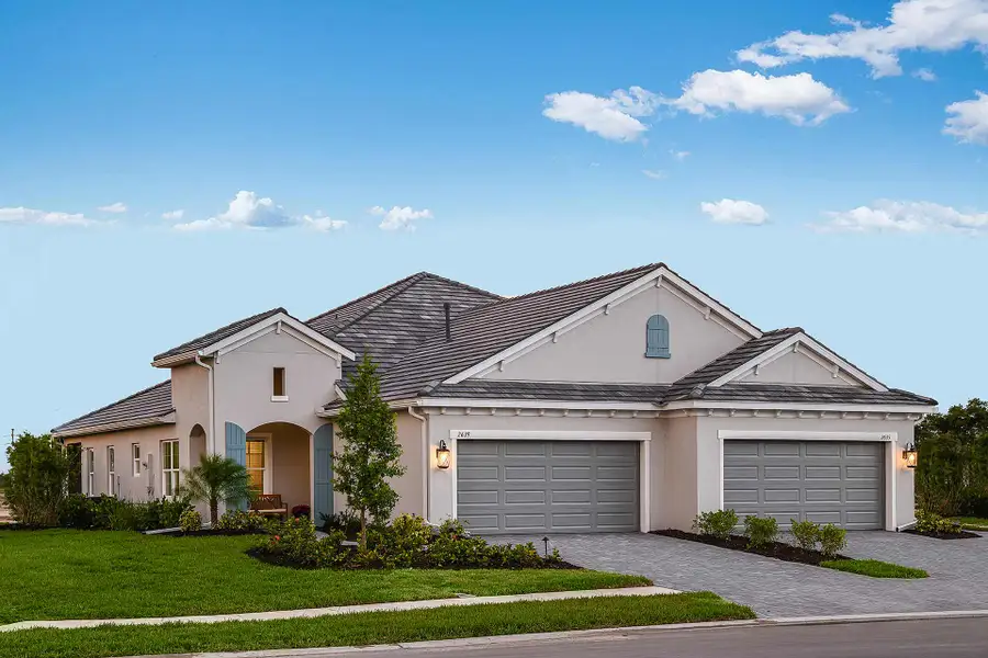 Representative exterior photo of a completed home built from the Crystal Sand by Neal Communities in Windward, Sarasota, FL (Image 1). Representative exterior photo of a completed home built from the Crystal Sand by Neal Communities in Windward, Sarasota, FL (Image 1).