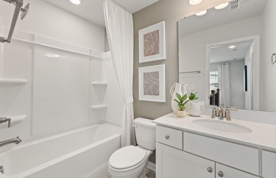 Furnished interior view inside a new home in Lakeside Townes at Riverlights, Wilmington (Image 6).