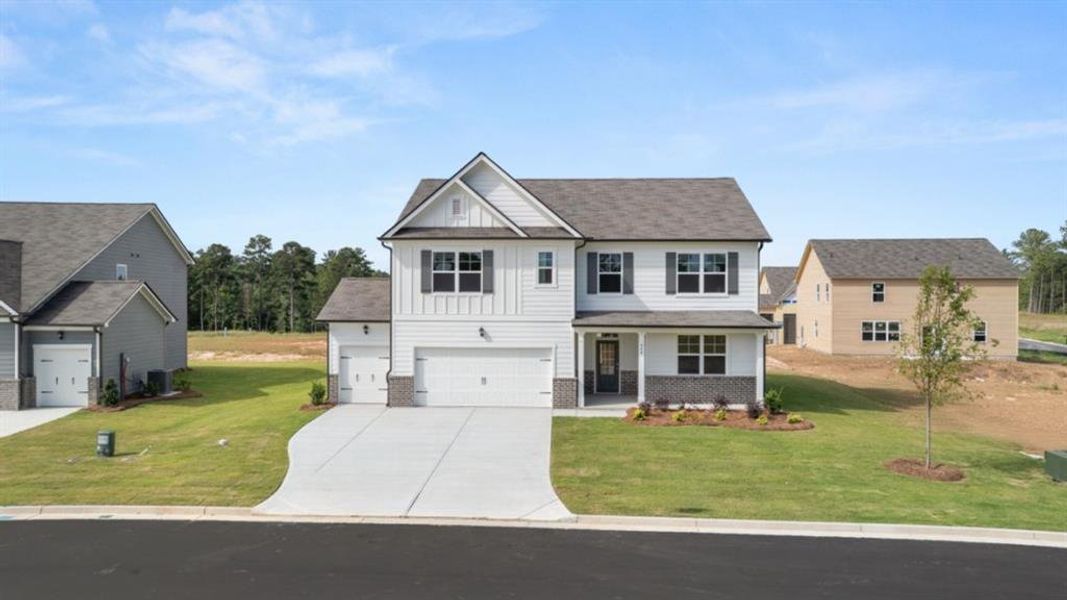 Front exterior of a new home in Fairway 17 at Mirror Lake, Villa Rica, GA, highlighting curb appeal (Image 22).