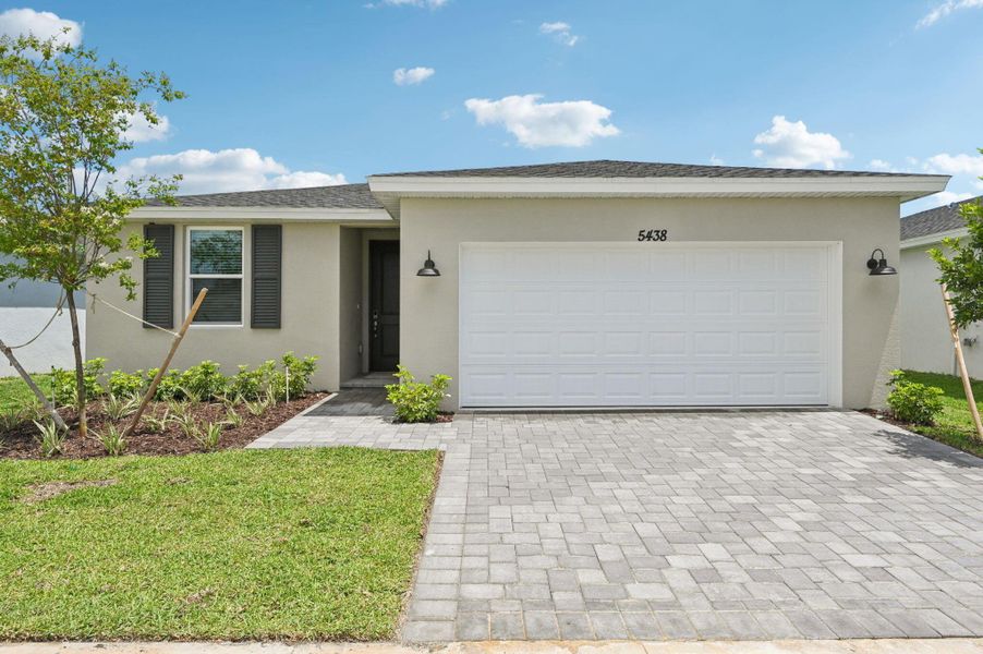 Front exterior of a new home in Hampton Park - Classic Series, Vero Beach, FL, highlighting curb appeal (Image 1). Front exterior of a new home in Hampton Park - Classic Series, Vero Beach, FL, highlighting curb appeal (Image 1).