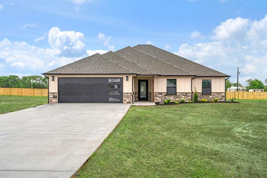 Front exterior of a new home in , Sumner, TX, highlighting curb appeal (Image 2). Front exterior of a new home in , Sumner, TX, highlighting curb appeal (Image 2).