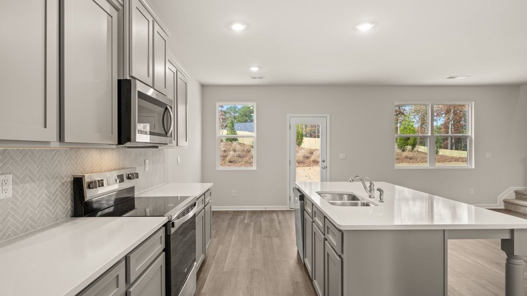 Representative furnished interior of a home built from the ANSLEY Express by D.R. Horton in WillowBrook, Winder (Image 9).