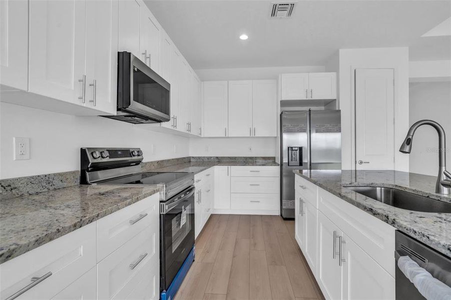Furnished interior view inside a new home in , Okeechobee (Image 10).