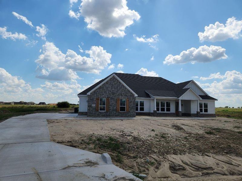 Front exterior of a new home in Rocky Top, Krum, TX, highlighting curb appeal (Image 1). Front exterior of a new home in Rocky Top, Krum, TX, highlighting curb appeal (Image 1).